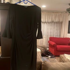 A closet staple! A classic Black dress with flattering ruching, flutter sleeves